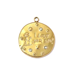 Detailed macro view of a gold stainless steel pendant with I LOVE YOU DAD engraving