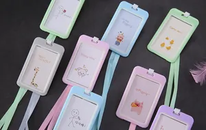 Detailed view showing a variety of colorful cartoon ID card holders with matching lanyards