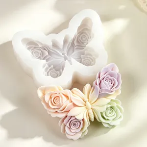 Detail view of butterfly rose wing silicone mold and colorful finished wax piece