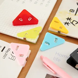 Multicolor plastic triangular paper corner clips for organizing school and office documents