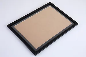 Detailed perspective view of a black photo frame with white matting for scratch art
