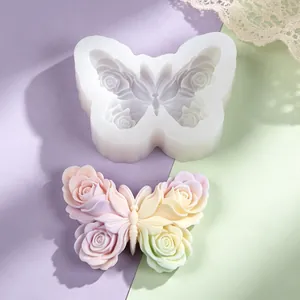 Detail of butterfly rose wing silicone mold and finished colorful wax ornament
