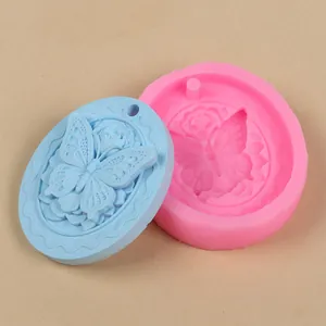 Detailed view of oval butterfly and rose silicone mold with finished casting example
