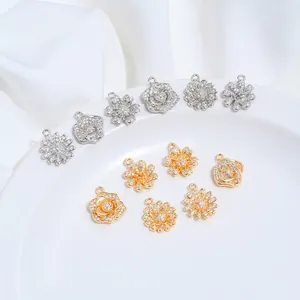 Close-up of 14K gold plated flower pendants with shimmering zircon for DIY jewelry making
