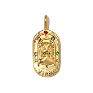 Detailed macro shot of vintage gold Virgo zodiac pendant with colorful crystal accents
