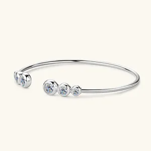 Close-up of minimalist S925 sterling silver open cuff bracelet with moissanite bubbles
