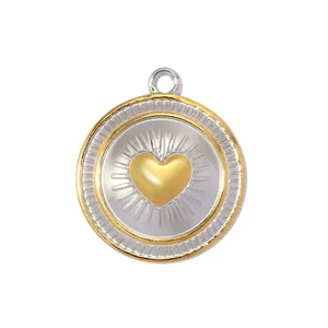Close-up detail of two-tone stainless steel heart pendant with sunburst rays decoration