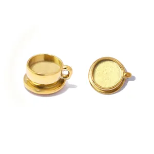 Close-up of golden stainless steel miniature coffee cup pendants for jewelry DIY