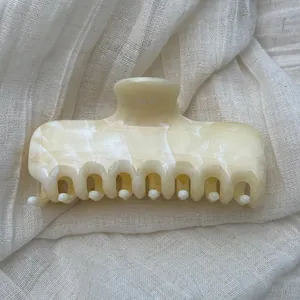Elegant French style hair claw clip featuring a cream marble ink wash pattern texture detail