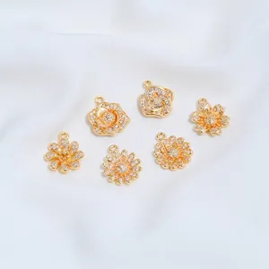 Close-up of 14K gold-plated flower pendants set with sparkling cubic zirconia