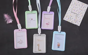 Detailed view of multiple colorful cartoon ID card holders with matching lanyards