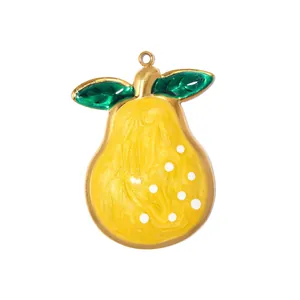 Macro detail of a bright yellow pear-shaped stainless steel pendant with green leaves