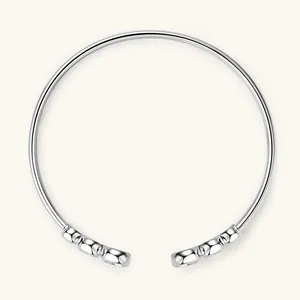 Detailed macro view of an S925 sterling silver bubble open bangle with polished finish