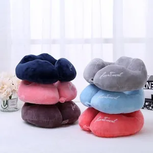 Detailed view showing a variety of colorful plush U-shaped neck pillows for travel comfort