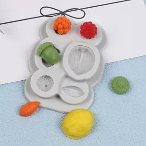 Detailed close-up of a DIY nut series silicone mold showing various fruit and nut shapes
