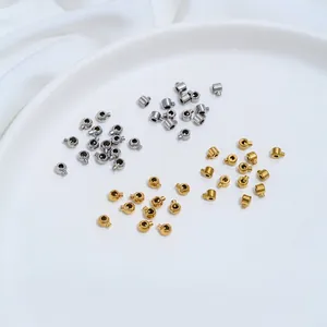Close-up of gold and silver stainless steel positioning clasps for DIY jewelry making.