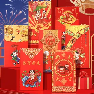 Detail of festive Chinese New Year red envelopes with traditional gold stamped patterns.