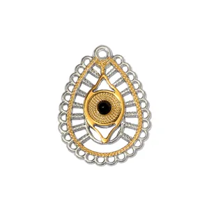 Detail of bi-color stainless steel evil eye pendant with intricate filigree pattern