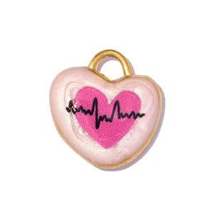 Close-up of stainless steel heart pendant with pink heartbeat ECG enamel detail