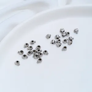 Detailed macro view of silver stainless steel positioning clasps for DIY jewelry making.