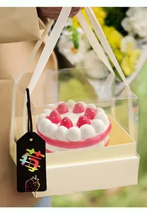DIY rainbow scratch art tag on a gift box showing a colorful strawberry design