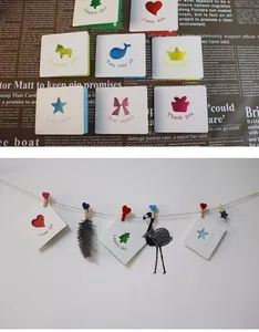 Detailed view of mini hollow-out greeting cards with various decorative cutout designs