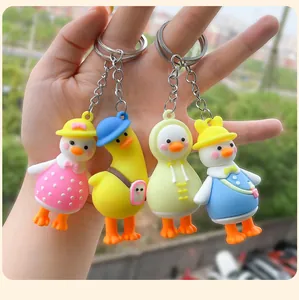 Set of 4 cute cartoon duck keychains with colorful outfits for bag charms