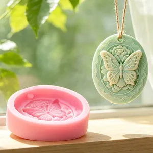 Detailed view of oval butterfly rose silicone mold for DIY aromatherapy wax pendants