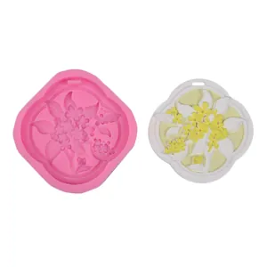 Detailed view of floral silicone mold for aroma wax pendants with finished product