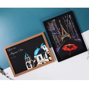 Modern black and natural wood photo frames showcasing city night view scratch art designs