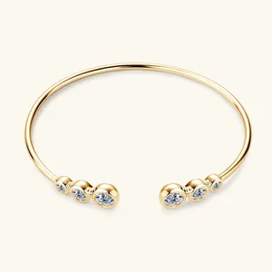 Detail view of S925 sterling silver open bangle featuring six brilliant moissanite stones.
