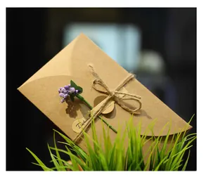 Detailed view of a retro kraft paper greeting card with dried lavender and rustic twine