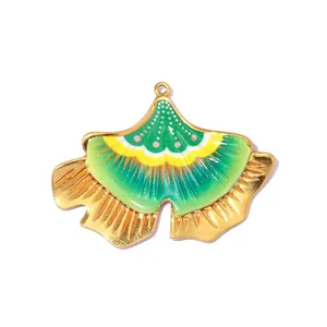 Vibrant green and gold ginkgo leaf enamel pendant for elegant DIY jewelry designs