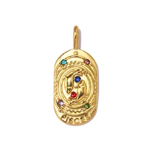 Detailed view of vintage gold Pisces zodiac pendant with multi-colored crystals