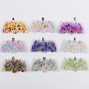 Detailed view of nine colorful bat-shaped skin picking fidget toys with bead fillings