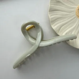 Large sage green minimalist hair claw clip with smooth curved design