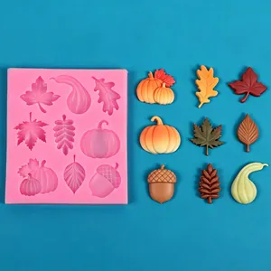 Detail view of harvest season themed silicone mold with pumpkin and maple leaf shapes.