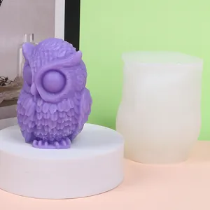 Macro detail of high-quality owl silicone mold and finished purple aromatherapy candle