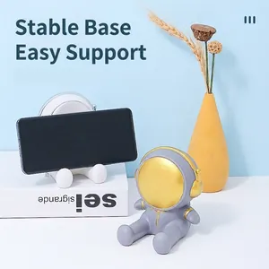 Creative astronaut spaceman phone holder for desktop decor and hands-free viewing