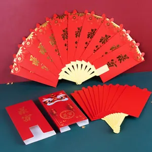 Detail view of Chinese New Year festive red tags with gold foil characters and lion dance