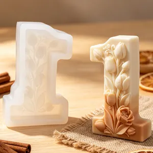 Close-up of number 1 silicone mold and floral embossed candle with tulip patterns