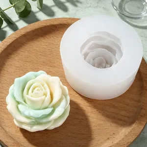 Detailed view of white 3D rose silicone mold and finished handmade aromatherapy soap