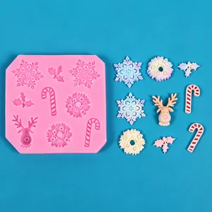 Detailed view of Christmas silicone mold and colorful resin snowflake and reindeer shapes