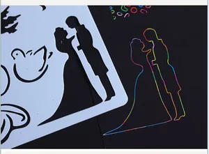 Close-up of a couple silhouette scratch art stencil and rainbow colored drawing result