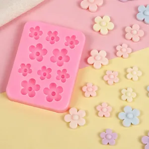 Detail of flower silicone mold with finished pastel clay blossoms.