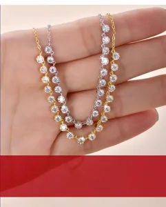 Detailed view of D color 3EX cut Moissanite bubble necklaces in 14K gold and silver finish