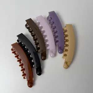 Set van kleurrijke banaan haarclips met glanzende afwerking voor paardenstaart kapsels