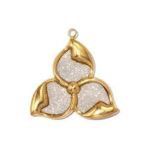 Detailed view of a gold and silver two-tone three-petal flower pendant in stainless steel