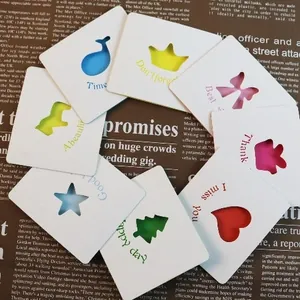 Creative hollowed-out greeting cards with colorful cutouts and short English phrases