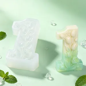 Detailed view of floral number 1 silicone candle mold with a finished gradient candle